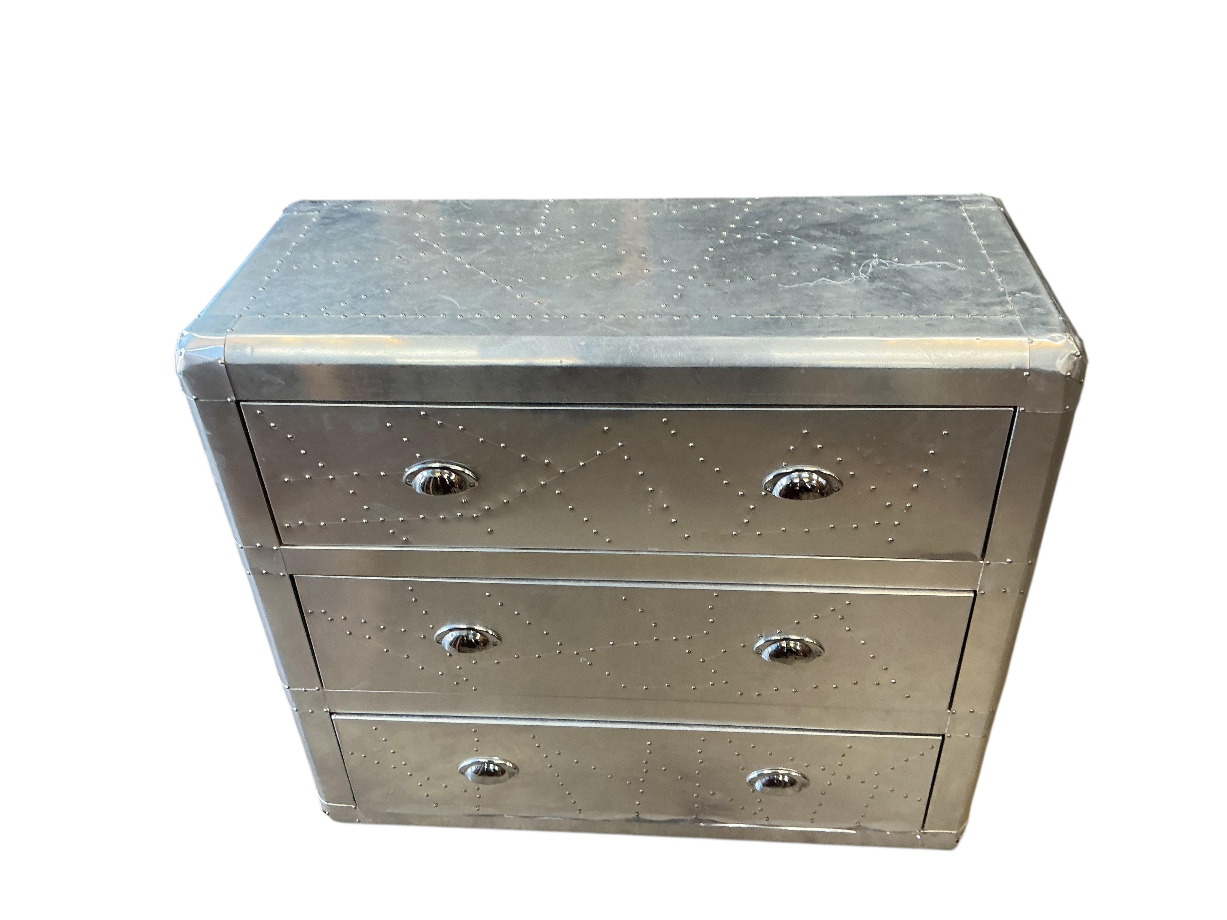 A pair of Contemporary aeronautical style aluminium mounted chest of three drawers, width 90cm, depth 38cm, height 79cm